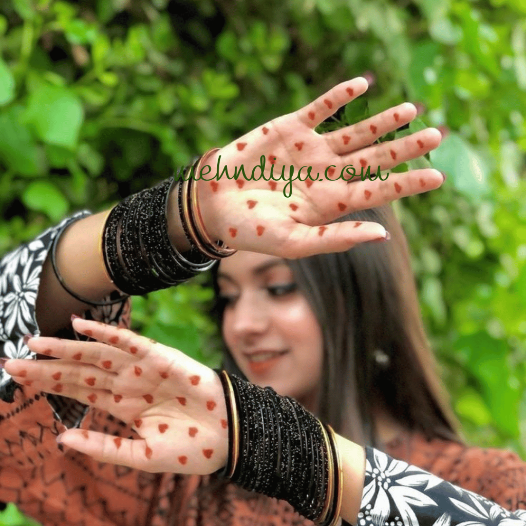 beautiful girl having full hand covered with small hearts aesthetic look