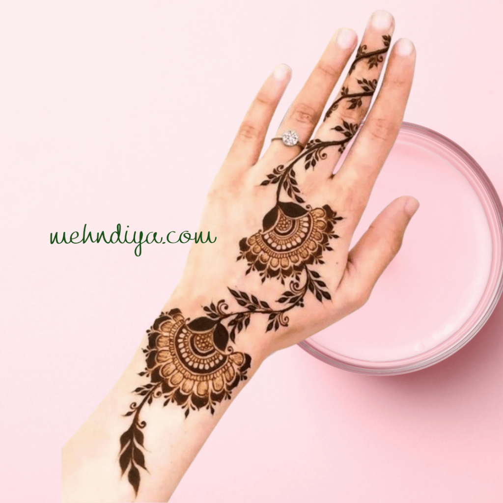 the beautiful henna design of the peacock having feathers and beautiful leafy pattern