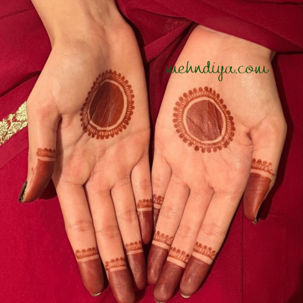 A girl hand with henna made in round pattern more like traditional style